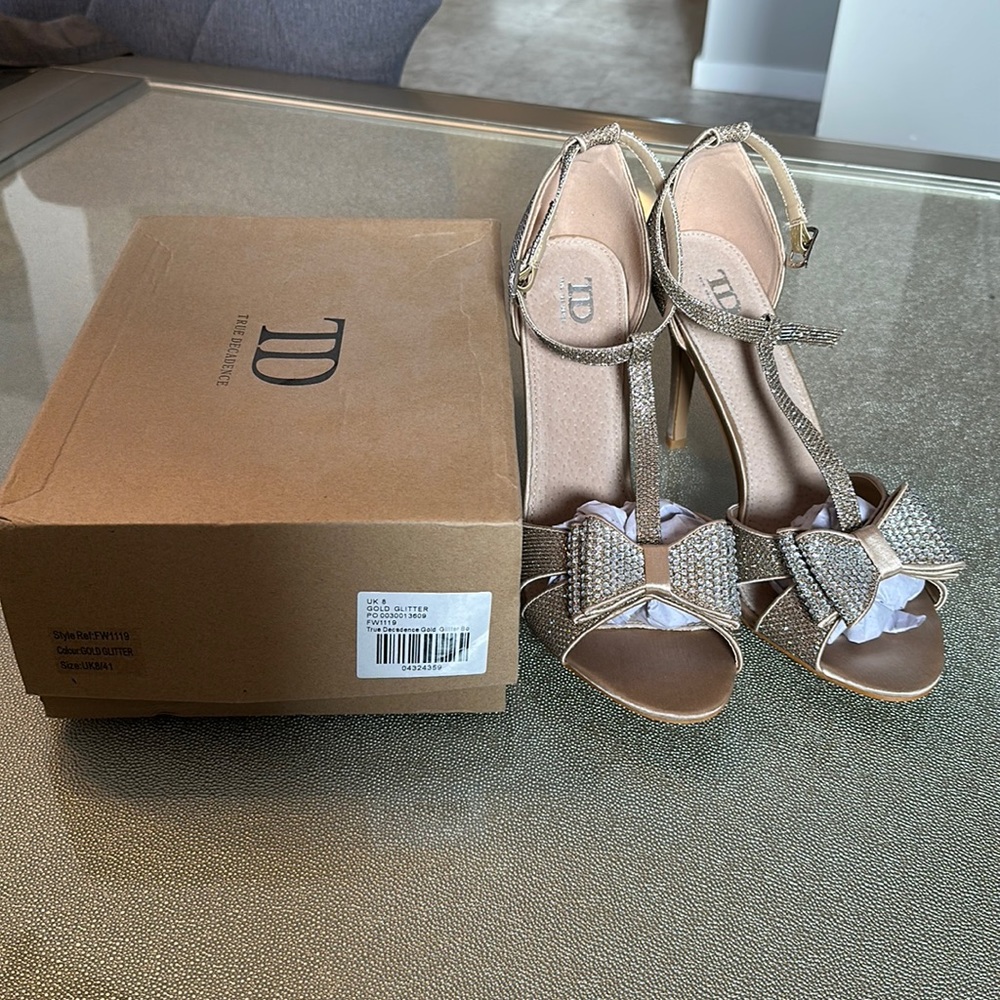True Decadence Gold Glitter Bow Heels